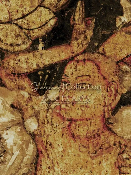 A close-up of the inspiration for the Ajanta and Ellora collection. The raw, expressive faces from the ancient cave paintings are the source for artworks that can be printed on textiles, wood, or other surfaces.