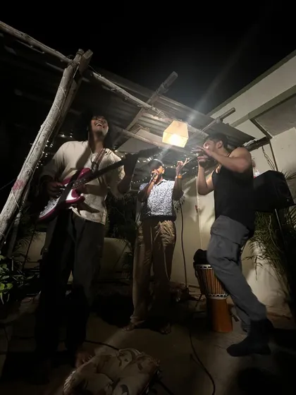 Some of the best moments are unplanned. This is a shot from a rooftop jam session in Bangalore, where I'm beatboxing alongside a guitarist and another vocalist. I love collaborating with other musicians to create something new in the moment.