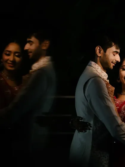 Playing with reflections to create a dreamy and artistic couple portrait. This technique adds depth and a touch of magic to this sangeet night photograph.