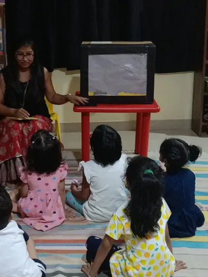 The lights go down for a shadow puppet show, creating an atmosphere of wonder and excitement. This classic storytelling technique sparks the imagination as characters appear and disappear in a dance of light and shadow.