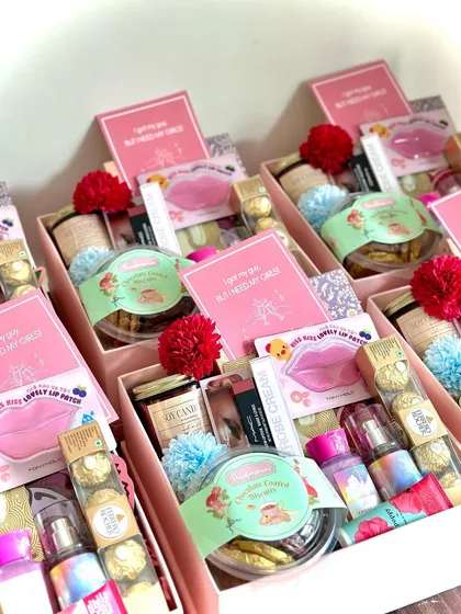 Here's a look at one of my most luxurious bridesmaid hampers. It's filled with over 15 items, including products from MAC, Kama Ayurveda, and Bath & Body Works, plus sweet treats and custom cards.