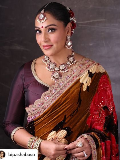 A classic, smiling portrait of Bipasha looking towards the camera. It's important to have a mix of posed and natural shots for a complete album.