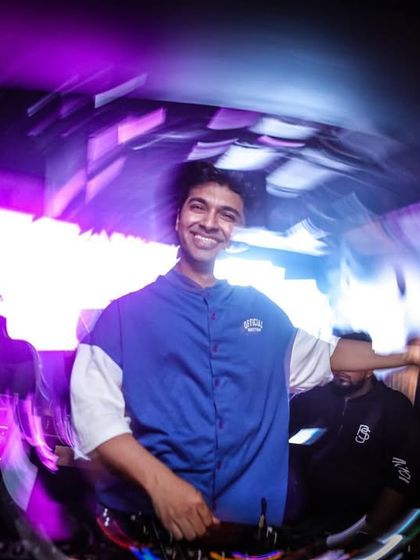 A happy, candid moment from a night at Vault in Pune. The swirly lights capture the dizzying fun of the party.