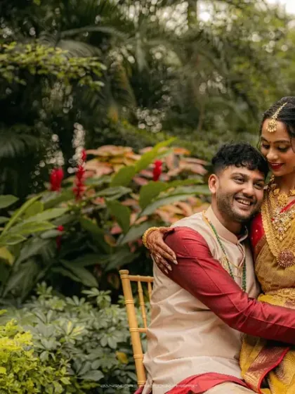 Surrounded by the vibrant greens and reds of a beautiful garden, this couple shares a relaxed and happy embrace. This portrait showcases my ability to use natural environments to create a rich, colorful backdrop that enhances the warmth and joy of the moment.