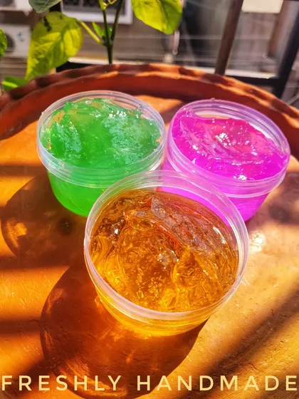 The vibrant colors of my handmade face gels. Here you can see the green, pink, and golden orange gels, each formulated with different natural ingredients to target specific skin needs while providing lightweight hydration.