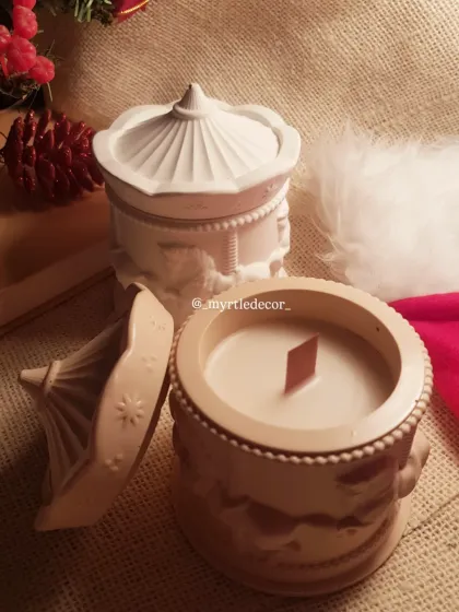 Our Carousel Christmas jar candles, made with 100% soy wax. The intricate carousel design on the Jesmonite jar makes it a beautiful keepsake long after the candle is gone.