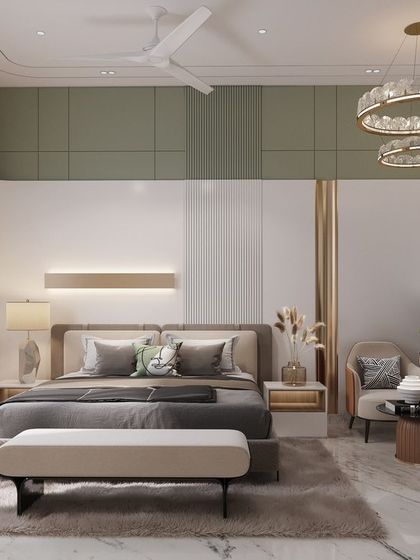 This bedroom design plays with curves and color to create a soft and serene environment. A gentle green accent wall with curved corners, paired with a modern circular chandelier, gives this room a unique, aesthetic, and calming feel.