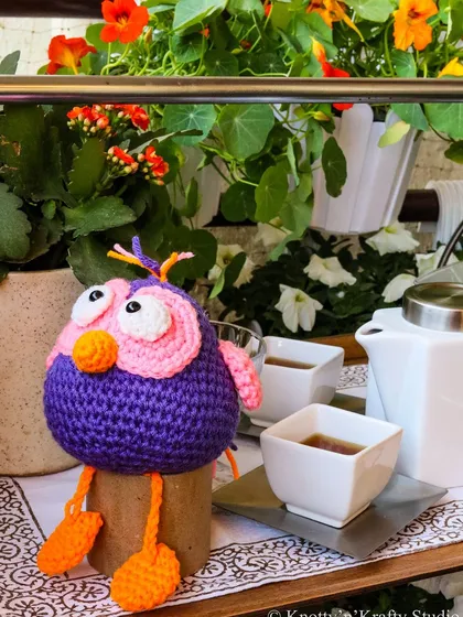 A Silly Bird tea party in the garden. These long-legged owls are designed to sit playfully on the edge of a shelf or planter.