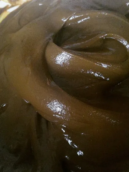 This is my therapy. The swirl in the henna paste shows its perfect, silky texture. I never use chemicals, only pure henna powder and essential oils.