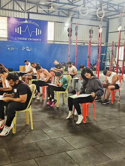 The theory part of the CrossFit certification seminar. Aspiring coaches taking their exams right here in our box.