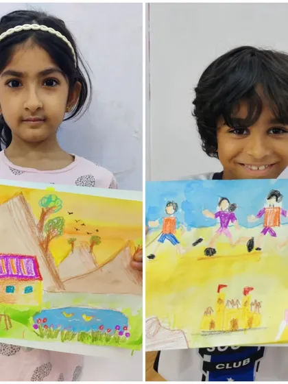 Here, two children were given the same theme and produced completely different worlds. One drew a peaceful house by a pond in the hills, while the other created a dynamic scene of children playing football.