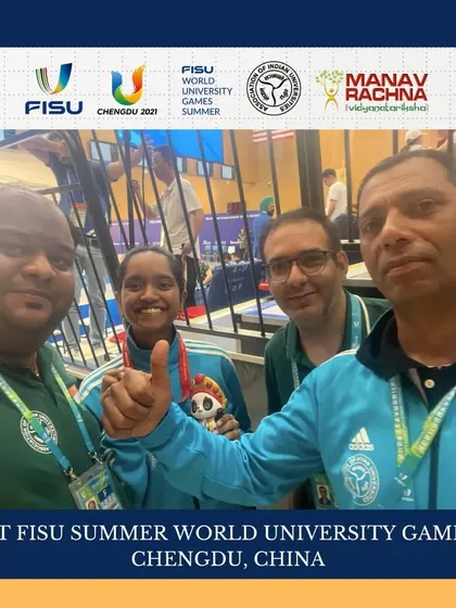 A moment of celebration with our team officials and a medal-winning shooter at the World University Games in China. We ensure our athletes have seamless championship experiences.