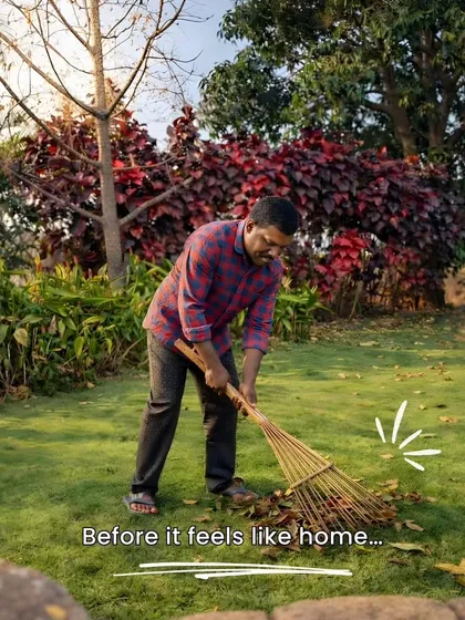 A beautiful garden starts with foundational care. Here, our team member is clearing away dry leaves, an essential step in keeping the lawn healthy and preventing pest infestations.