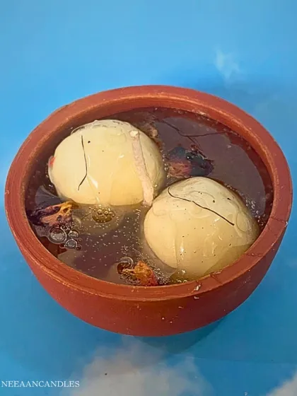 Our Rasgulla candle is one of my most hatke creations. Two juicy-looking rasgullas float in a scented gel wax inside a traditional earthen pot, complete with rose petals. It’s a fun, desi twist that brings a smile and a beautiful glow.