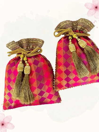 These brocade potlis in a vibrant rani pink are perfect for adding a pop of color to your outfit. The golden diamond pattern and tassels make them a festive and eye-catching choice.