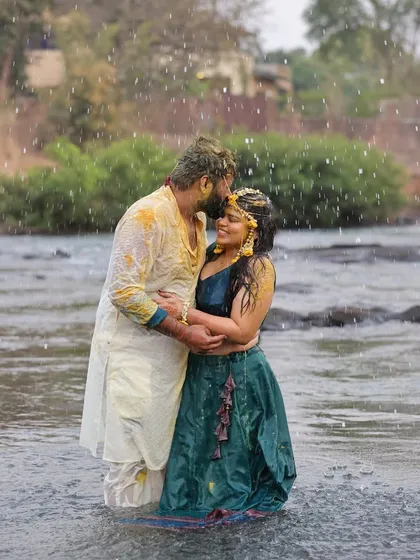 For couples looking for something unique, we create truly memorable pre-wedding shoots. This Haldi ceremony shot, taken in a river, combines tradition with a natural, adventurous setting for a one-of-a-kind photograph.
