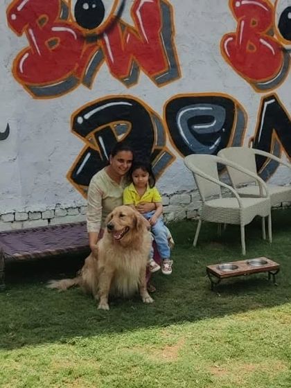 A quiet moment in front of our signature graffiti wall. Our space offers many spots for you and your pet to relax and take pictures.