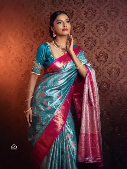 For this traditional wear shoot, my focus was on the rich texture and color of the silk saree. The studio lighting is carefully set to make the fabric's sheen and intricate details pop, creating an image of timeless South Indian elegance.