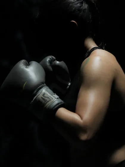 The focus, the power, the release. Our boxing and combat sports training is more than just a workout; it's a discipline that builds mental and physical strength. This shot captures the intensity and empowerment our members feel.