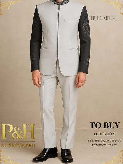 A detailed shot of the light grey zipper Jodhpuri, focusing on the contrast between the fabrics and the intricate sleeve embroidery.