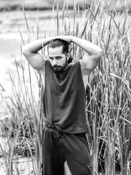 A series of portraits of actor Pruthvi Ambaar on location. These shots showcase a rugged, casual look against natural and industrial backdrops, highlighting his versatility.