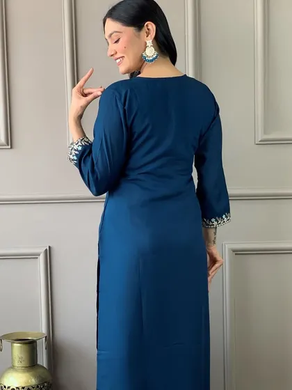This blue viscose chanderi kurta has such a classy vibe. The heavy thread embroidery on the neckline and cuffs adds a touch of elegance to a simple silhouette.