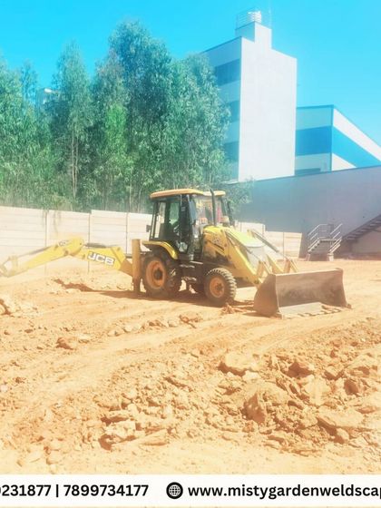 Before the green comes the groundwork. Here, a JCB is used to level the vast 30,000 sq ft area in preparation for soil filling and lawn installation.