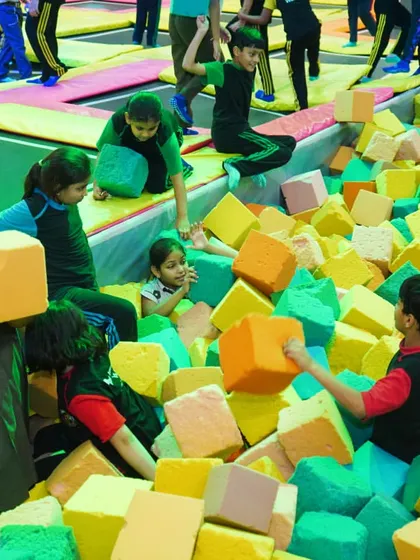 Students from a school trip enjoying the foam pit, a perfect place for them to play and unwind safely.