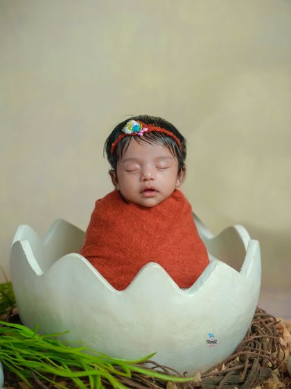 Another angle of the adorable 'hatching' concept. The rich terracotta wrap provides a warm contrast against the neutral background.