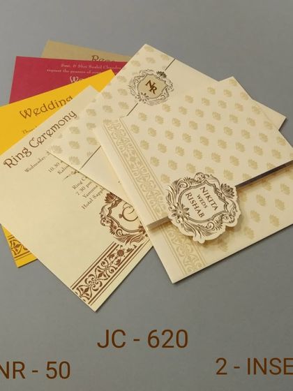 This affordable invitation set features a classic design with a decorative band. It comes with inserts in bright, festive colors like yellow and red.