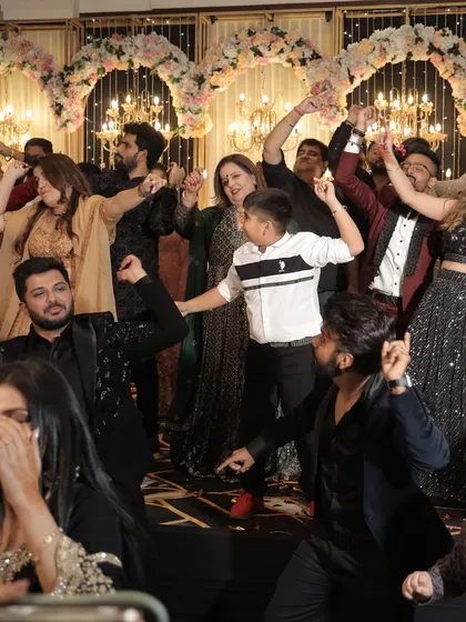 The entire dance floor filled with family and friends. Our goal is to get everyone up and celebrating together.