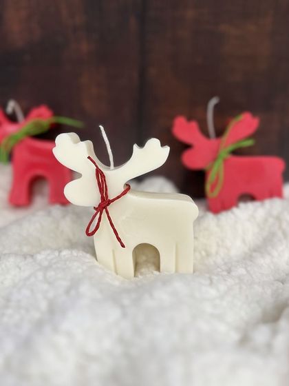 My cute reindeer candles are here for Christmas. Available in red or white, each one is tied with a small ribbon, making them an adorable gift or decor item.