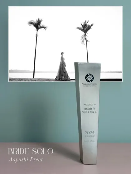 Our award for 'Bride Solo' portrait. This image of Aayushi against the stark backdrop of the sea and palm trees captures the kind of powerful, solitary beauty we love to create.