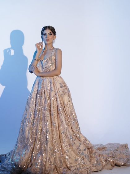 A stunning gown look for an engagement or reception. The makeup is kept elegant and glowing.