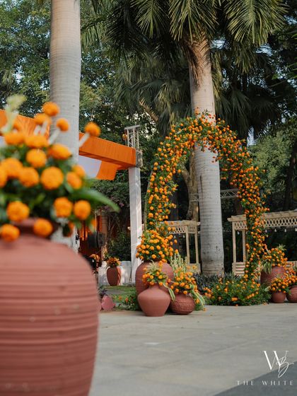 A view of the marigold-covered archway, framing the entrance to the Haldi celebration.