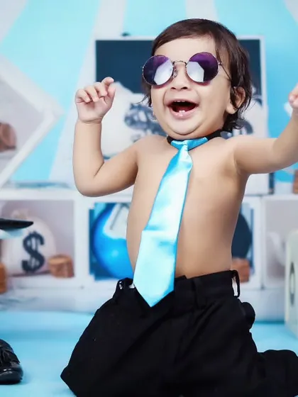 A moment of pure joy from our little boss, laughing and playing during his themed session.
