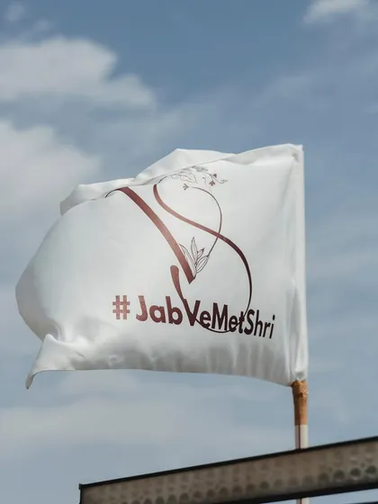 A custom flag with the couple's monogram and wedding hashtag, flying high at their celebration. These details help create a cohesive and personalized event identity.