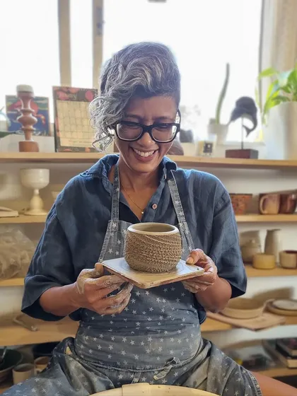 A happy moment in the studio, holding a freshly thrown piece. This week, I did a demo of the spiral throwing technique for my studio mates, a skill I recently learned in a workshop.