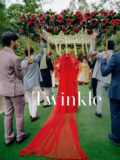 The bridal entry is a poem in motion. Here, the bride walks under a phoolon ki chadar, her long red veil trailing behind her like the beginning of a beautiful story. I aim to capture the emotion and grandeur of this tradition.