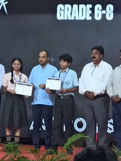 Aadi receiving his certificate on stage at the Astrofest event. We celebrate every student's success, whether it's in math, science, or the arts.