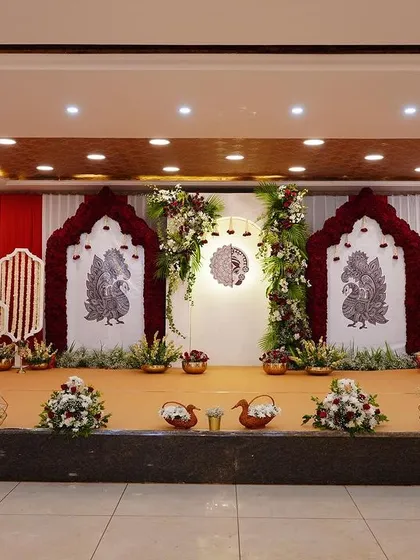 Tradition is at the heart of many family celebrations. For this naming ceremony, I created a rich and elegant stage using a classic red and white color scheme, intricate peacock motifs, and lush floral arrangements to honor the family's heritage.