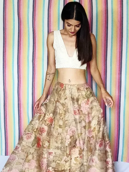 Here is a look that feels light and summery. I paired a hand-embroidered white Chikankari crop top with a flowing floral organza skirt. This is the kind of versatile Indo-western skirt set that you can dress up or down for any occasion.