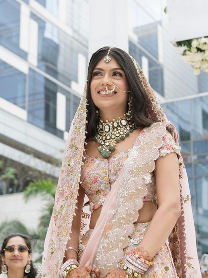 A low angle shot capturing Tanisha’s happy expression during her wedding. The natural makeup look was perfect for the outdoor setting.