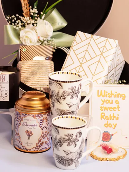This Rakhi, surprise your sibling with a luxe white leatherette box. It's filled with everything they'd actually want, including matching mugs, lavender tea, a scented candle, and other self-care goodies.