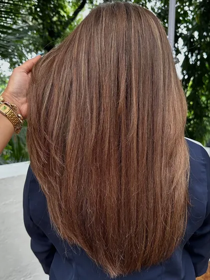 A classic 'Ash Blonde'. This is a great option for those who want to go lighter but prefer cooler tones over warm, golden shades. It's sophisticated and chic.