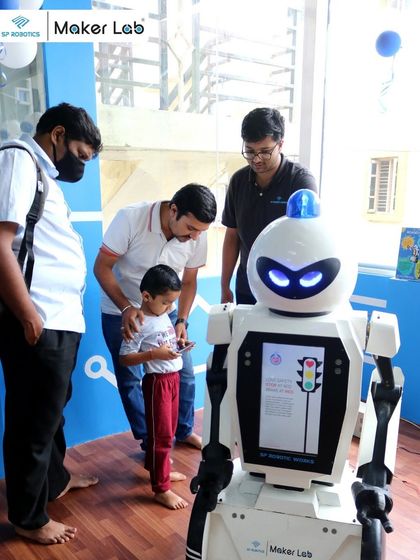 A young visitor interacts with our humanoid robot at a Maker Lab expo. These interactions are often the first spark that ignites a lifelong passion for robotics.