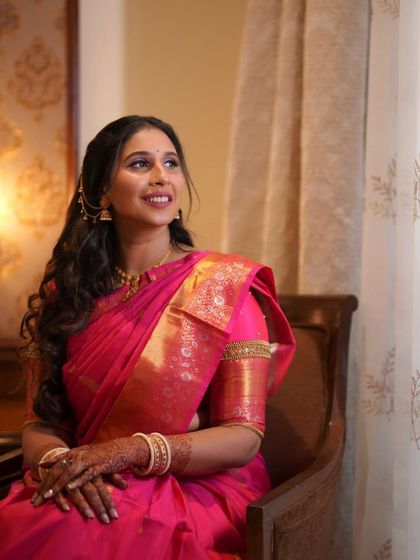 A candid shot of the mom-to-be, looking radiant and happy by the window.