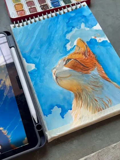 The painting on my sketchbook next to the digital reference. I can work from any photo you provide to create a custom pet portrait.