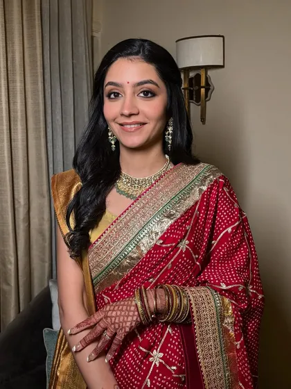 This client is the picture of grace and elegance at her reception. The makeup is understated, allowing her natural beauty and happiness to be the focus.