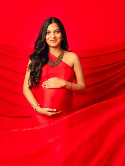 A beautiful shot of our red halter-neck gown, with the flowing fabric creating a dramatic and luxurious feel.